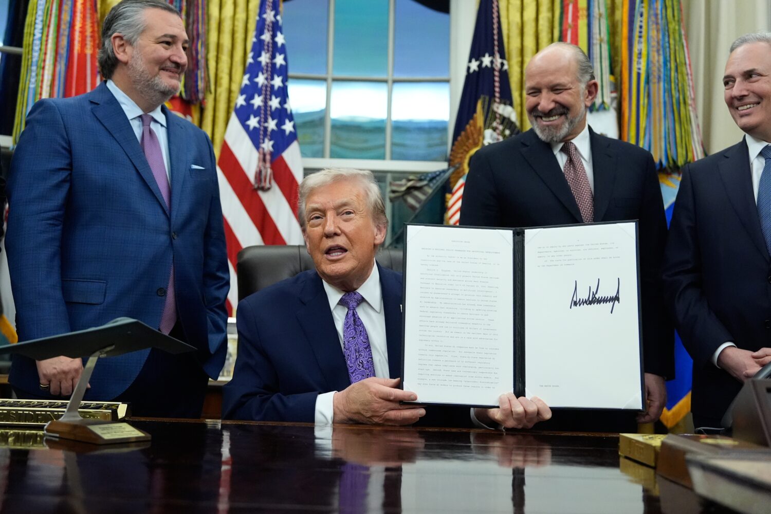 FILE - Flanked by Sen. Ted Cruz, R-Texas, left, Secretary of Commerce Howard Lutnick, second right,...