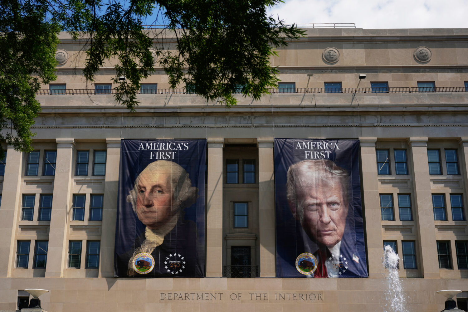 Banners, one of President George Washington that reads "America's First," left, and another of Pres...