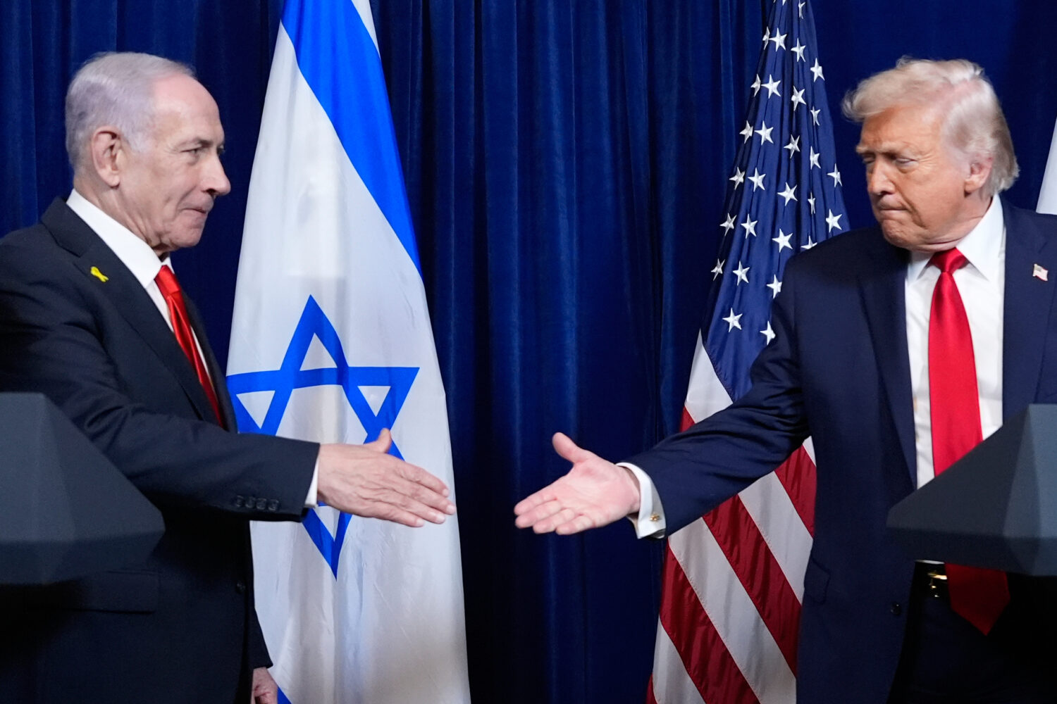 FILE - President Donald Trump shakes hands with Israel's Prime Minister Benjamin Netanyahu at the e...