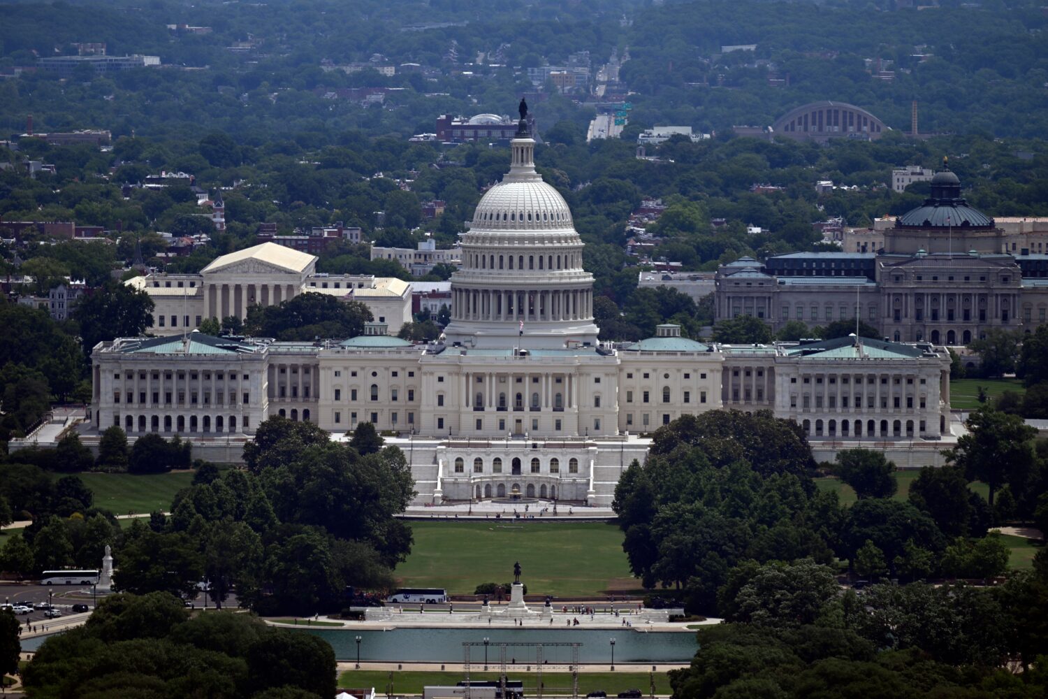The west front of the U.S. Capitol with the Supreme court on the left and the Library of Congress o...