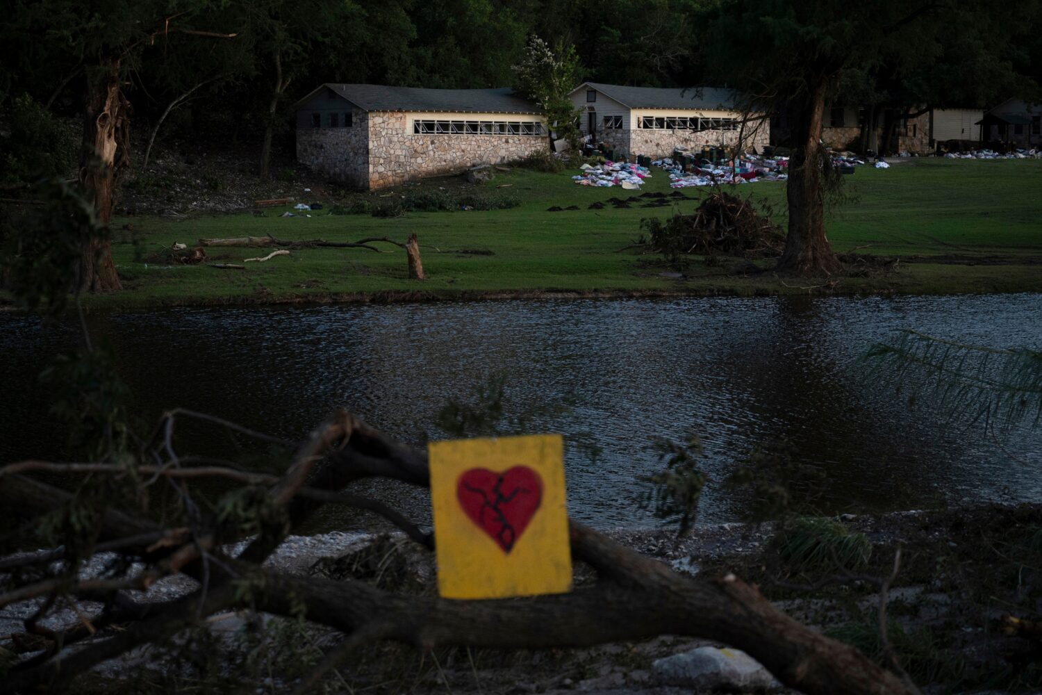 FILE - A broken heart sign is displayed near Camp Mystic on Tuesday, July 8, 2025, after a flash fl...