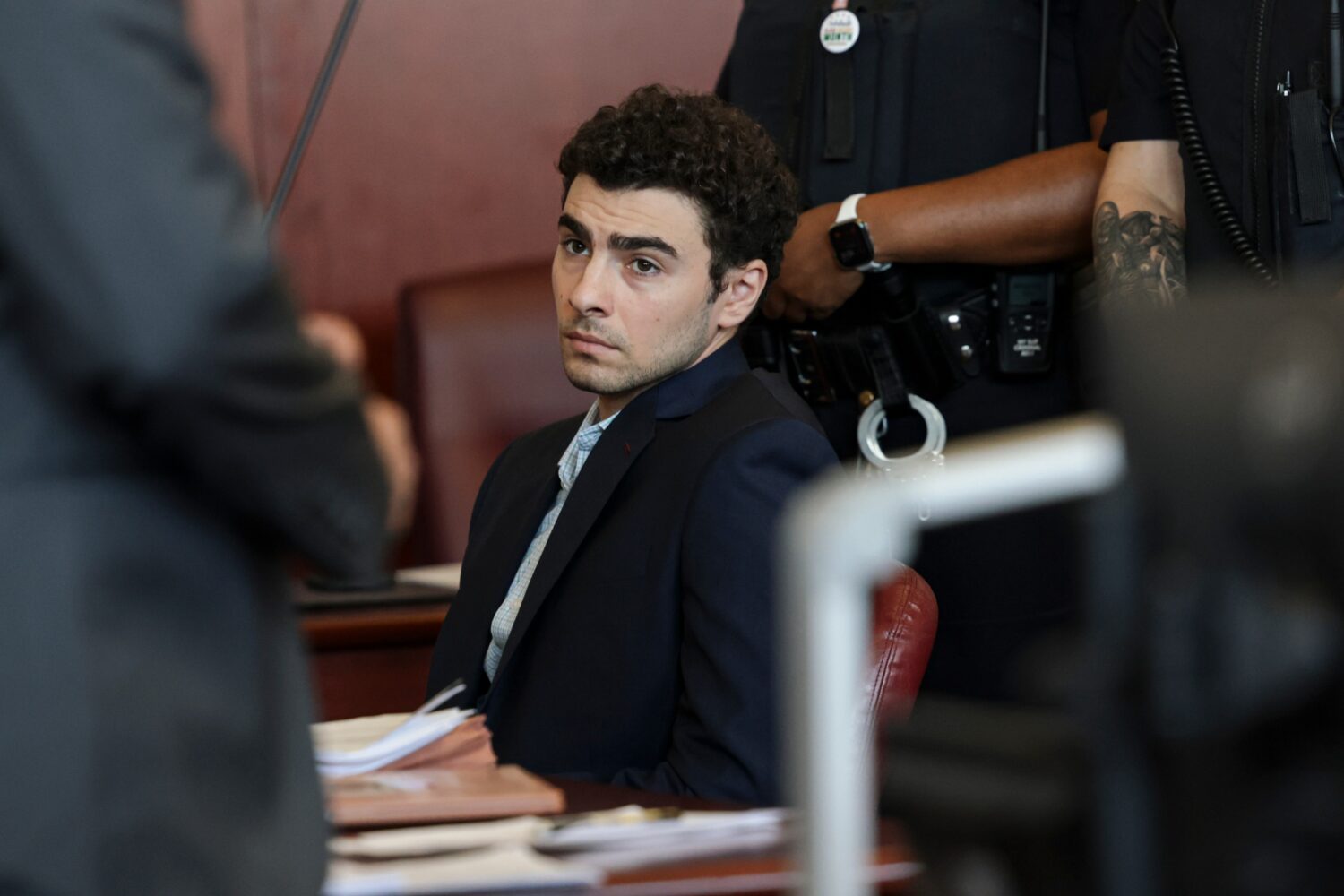 Luigi Mangione appears at a hearing in Manhattan Criminal Court in New York, Monday, May 18, 2026. ...