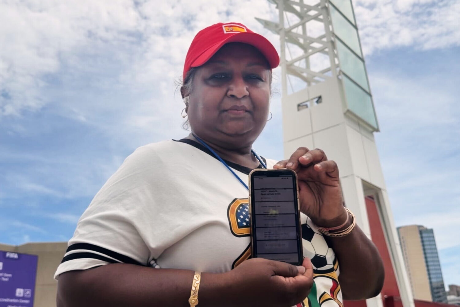 Bina Ramroop holds proof of the ticket she bought through StubHub for the World Cup Group H soccer ...
