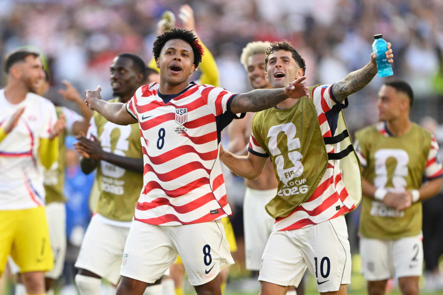 United States' Weston McKennie (8) and Christian Pulisic (10) celebrate winning the World Cup round...