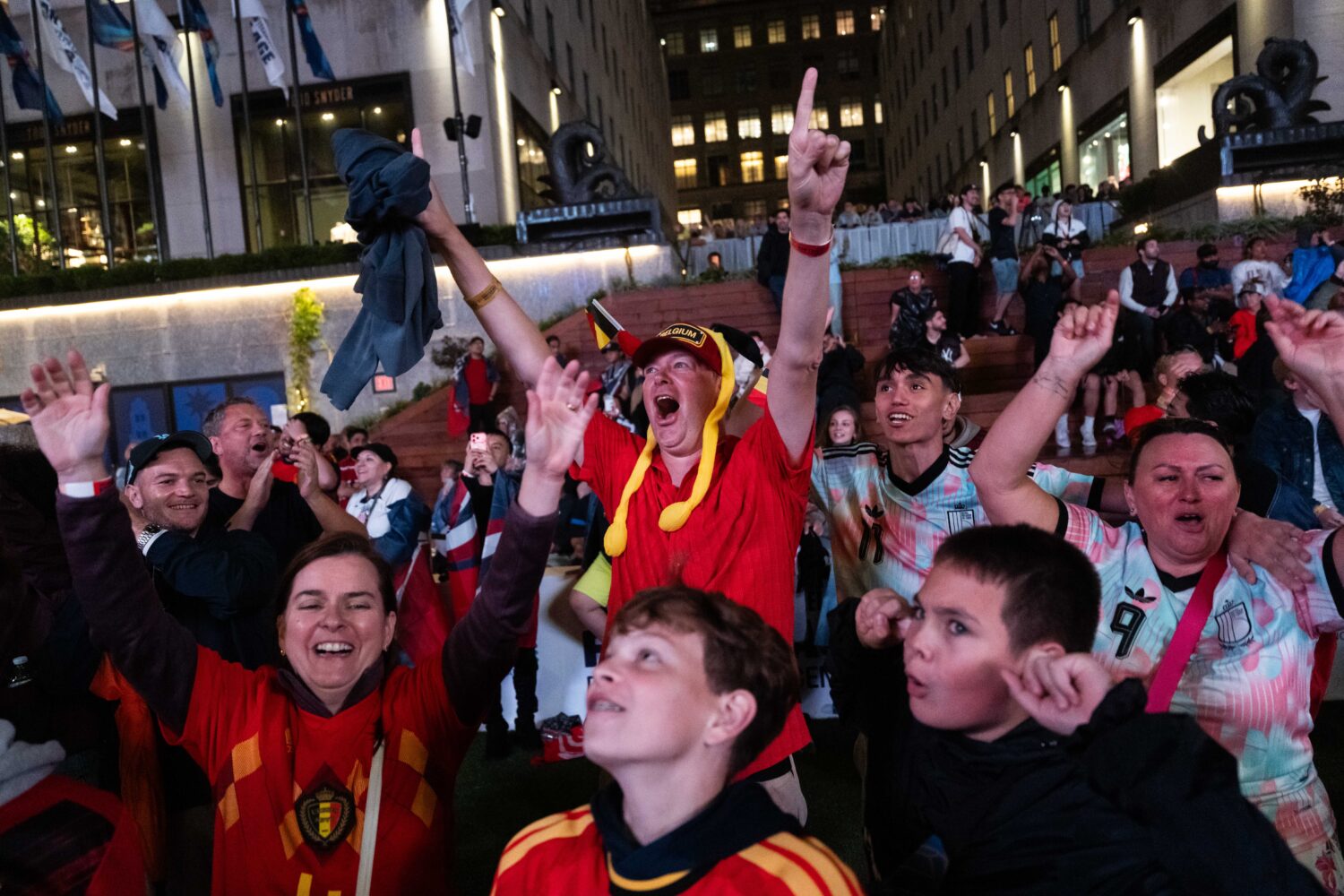Belgium fans react after the team scored during the World Cup round of 16 soccer match between the ...