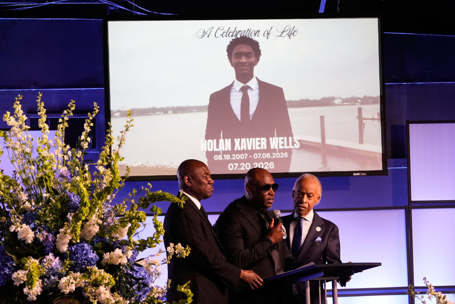 Elmore Wonsley, center, speaks next to attorney Ben Crump, left, and Rev. Al Sharpton during a memo...