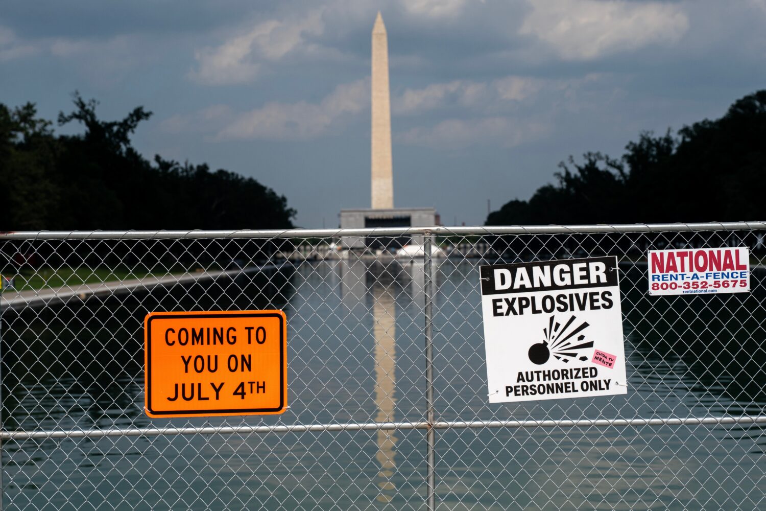 Signage and security fencing warns of explosives along the Lincoln Memorial Reflecting Pool ahead o...