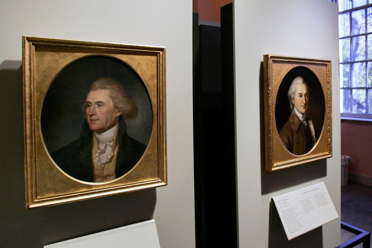 FILE - Portraits of a red-headed Thomas Jefferson, left, and John Dickinson, right, by by Charles W...