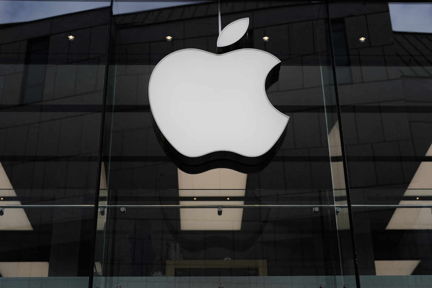 FILE - The Apple logo is illuminated at a store in Munich, April 2, 2026. (AP Photo/Matthias Schrad...