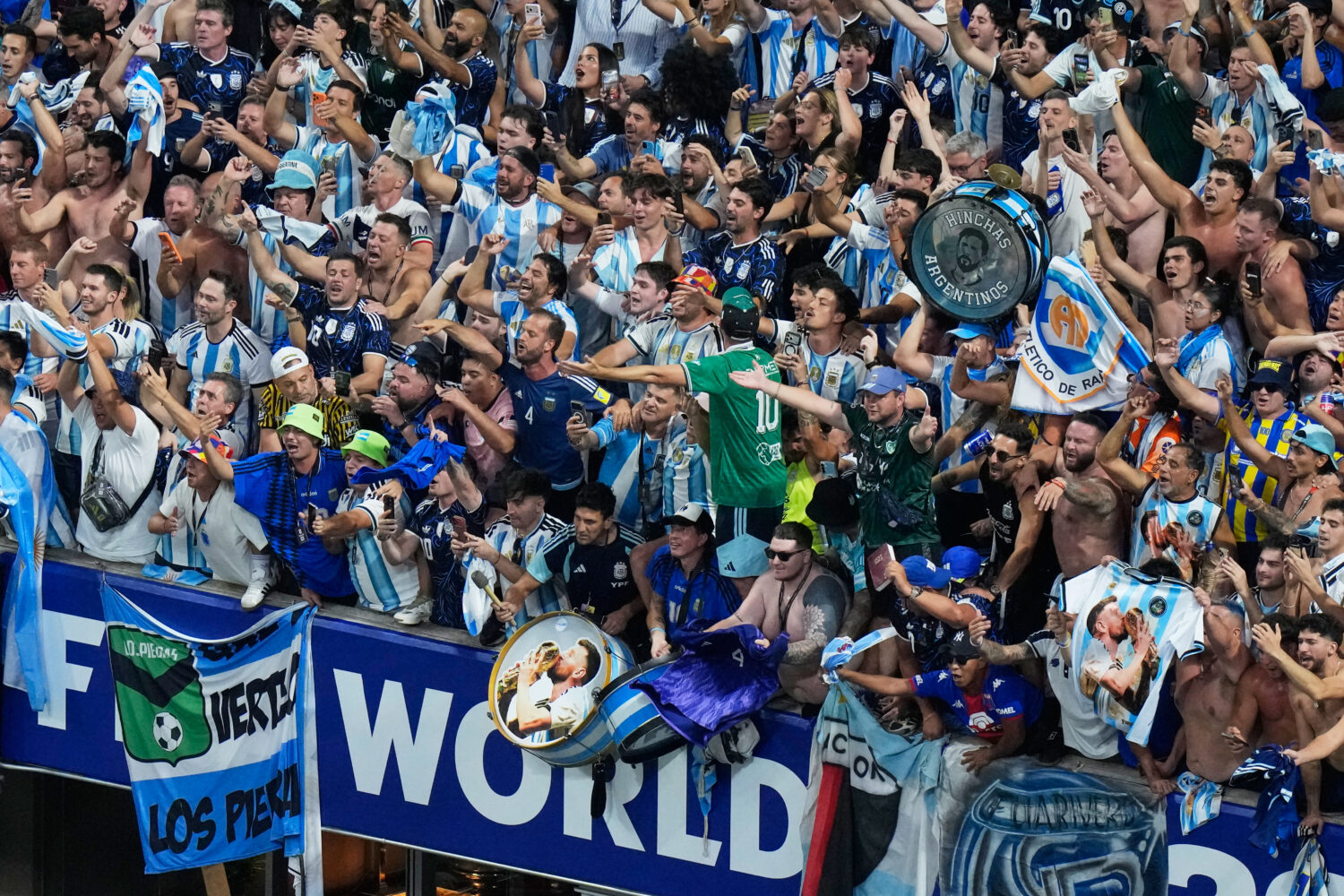Fans of Argentina celebrate after they defeated England in their World Cup semifinal soccer match i...