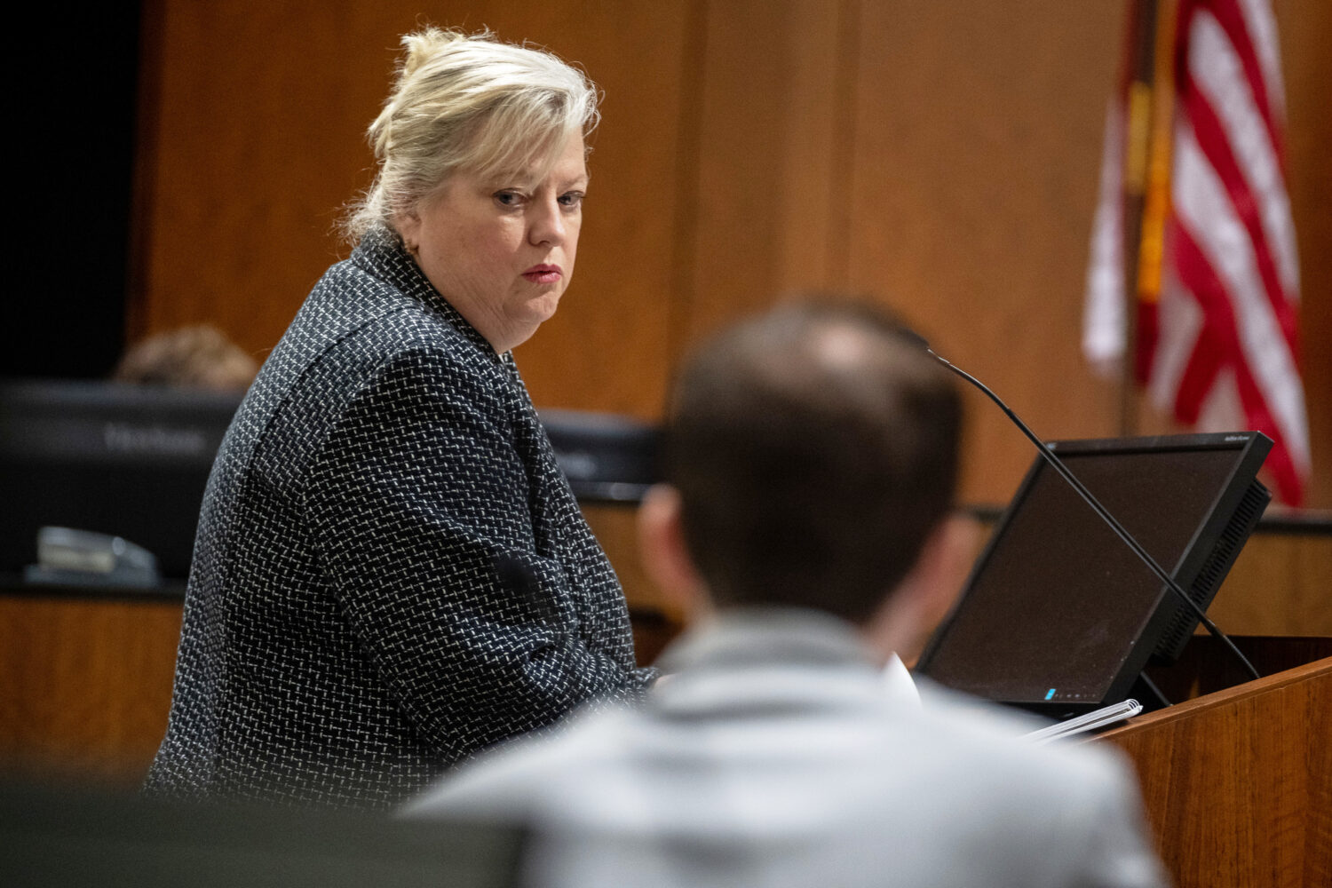 Defense attorney Kathryn Nester looks back past Tyler Robinson, who is accused of fatally shooting ...