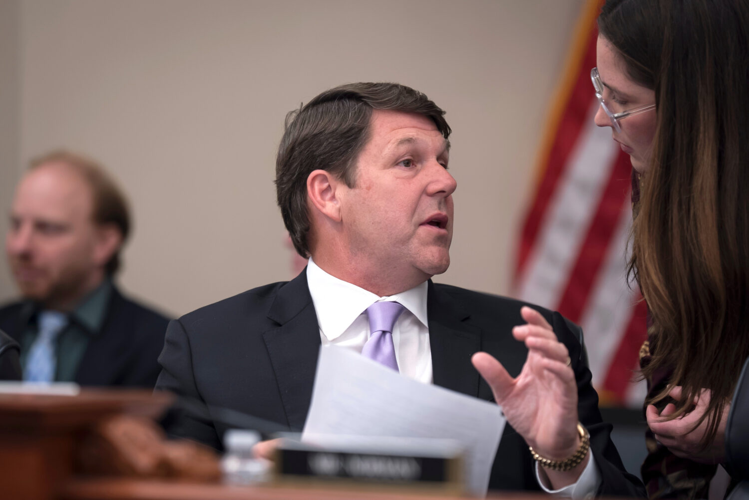 House Budget Committee Chairman Jodey Arrington, R-Texas, center, speaks with an aide during a mark...