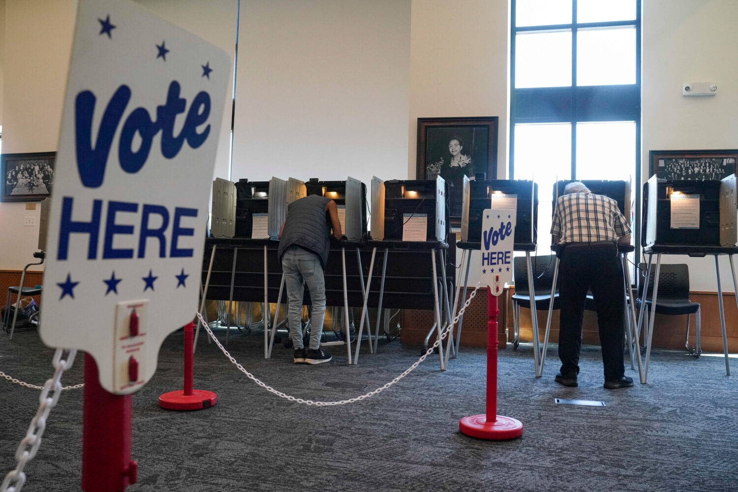 People vote in the Democratic primaries at Blair-Caldwell Library, Tuesday, June 30, 2026, in Denve...