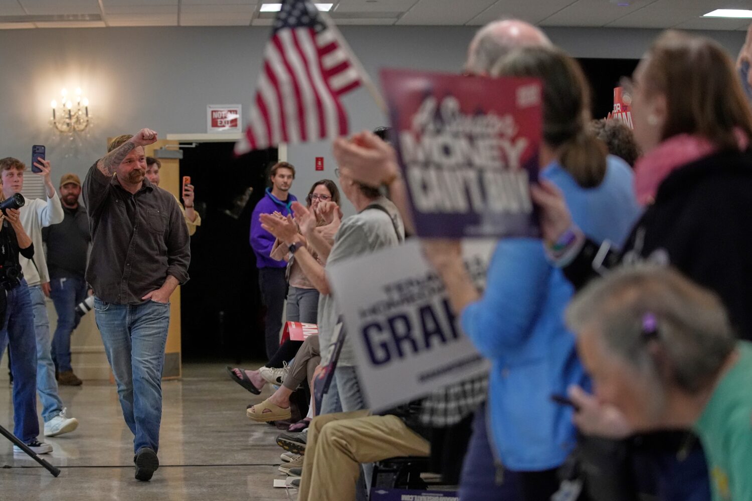 Graham Platner, Democratic candidate for U.S. Senate, acknowledges applause at a campaign event Sun...