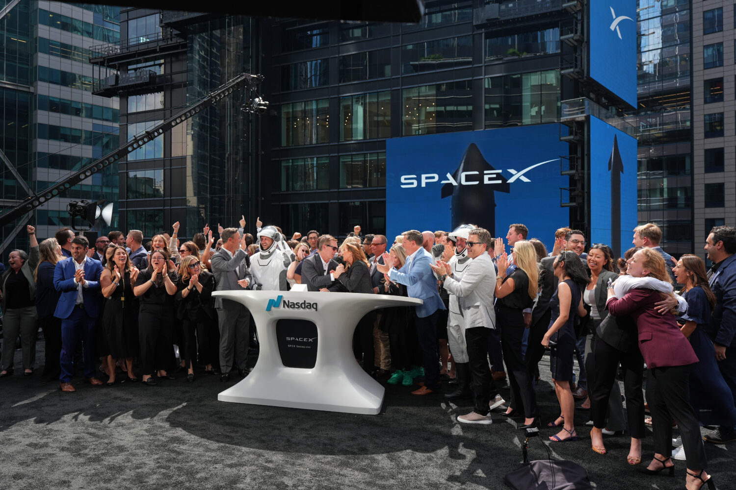 SpaceX employees celebrate during a closing bell ceremony for the IPO of SpaceX at the Nasdaq Marke...