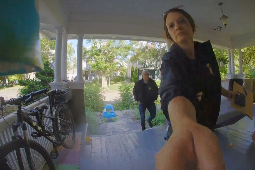 This photo provided by David Streever shows federal officers at David Streever's home in Rochester,...