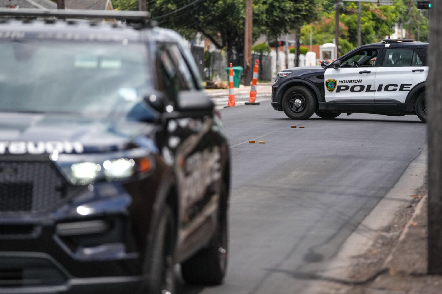 Police work on Canal Street in Houston, Tuesday, July 7, 2026, after a shooting. (Jacob Lujan/Houst...
