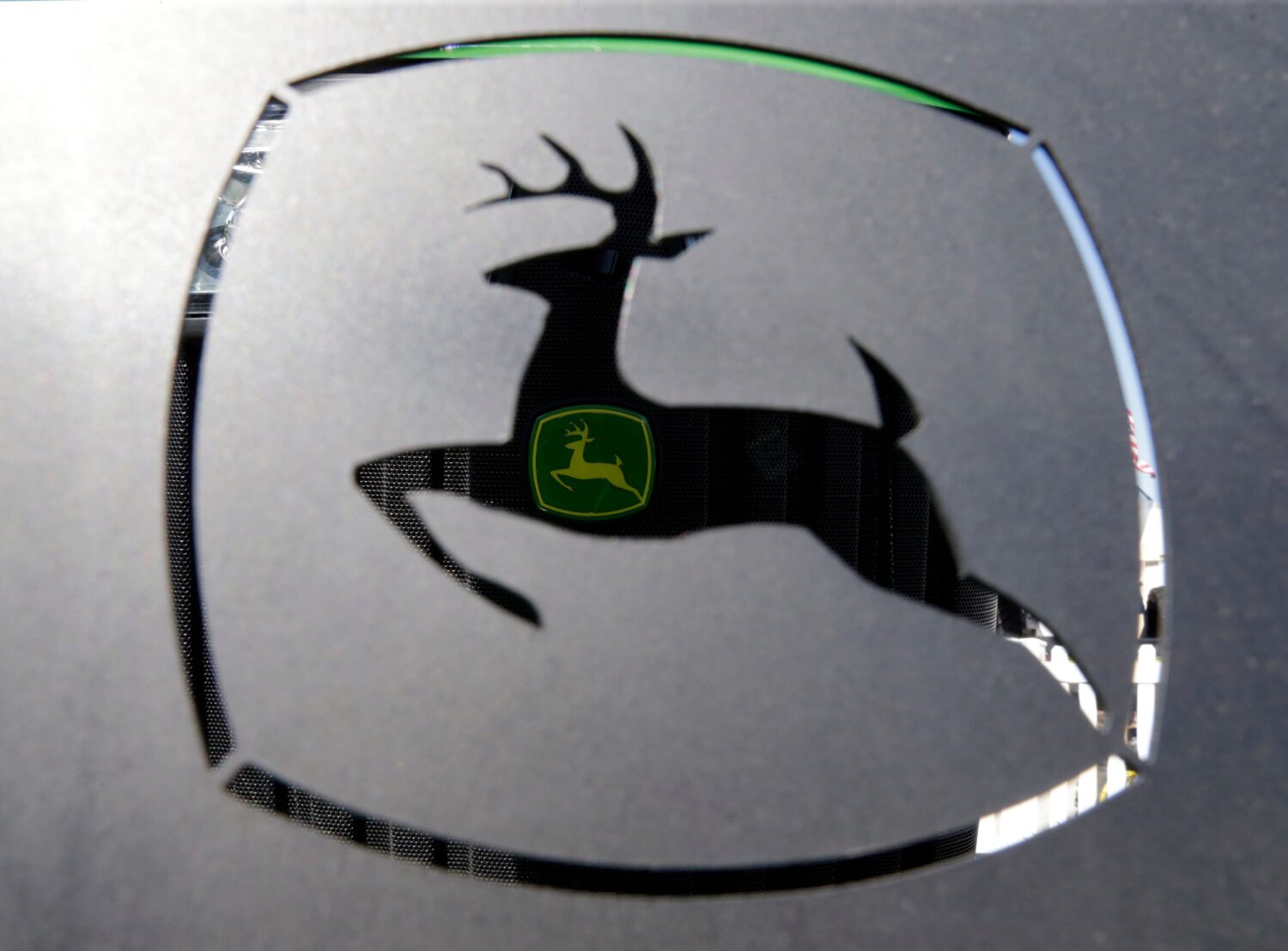 FILE - A John Deer emblem is seen at the Husker Harvest Days farm show in Wood River, Neb., Sept. 1...