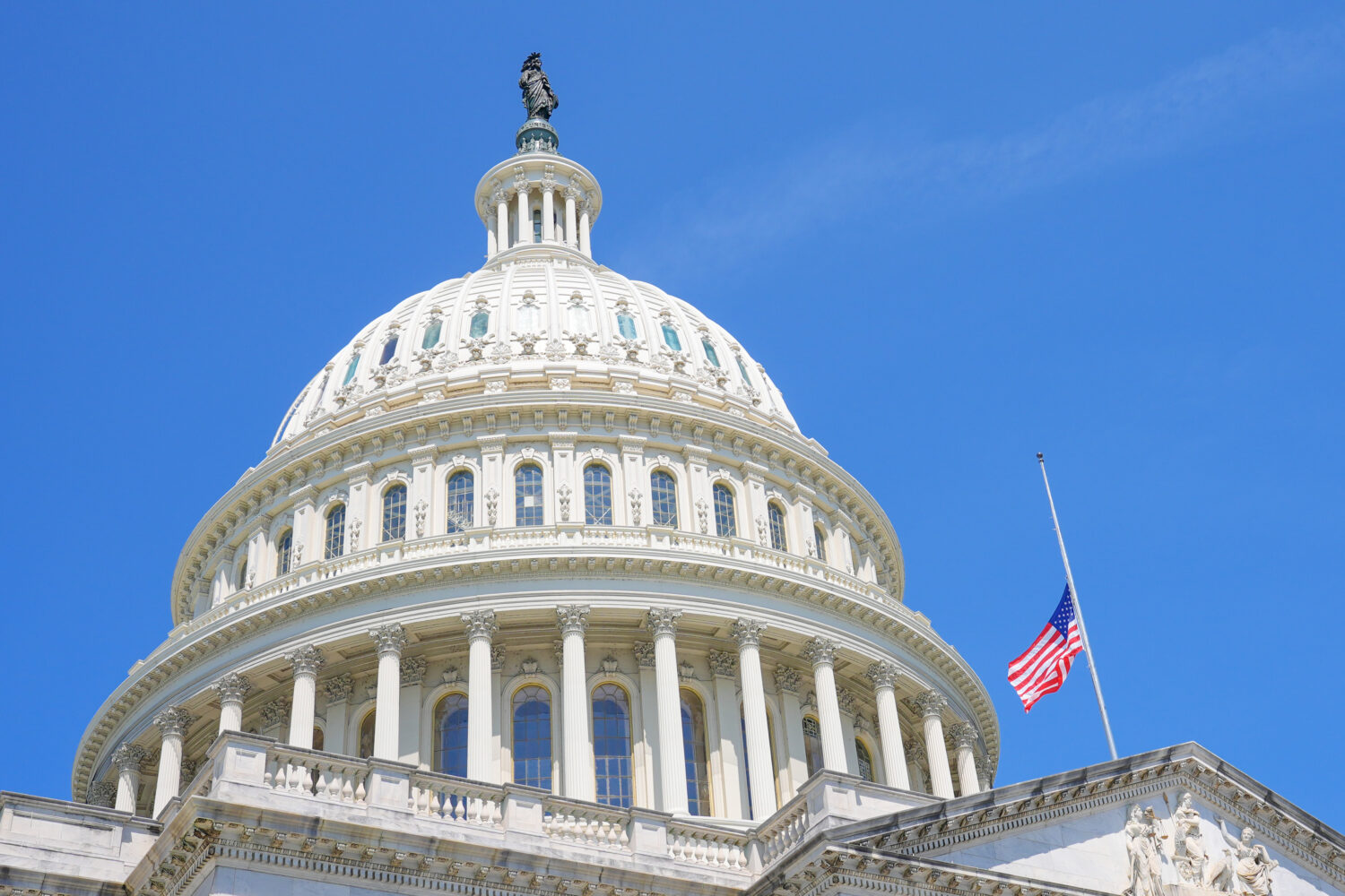 The American flag flies at half staff at the Capitol in Washington, Monday, July 13, 2026, after th...