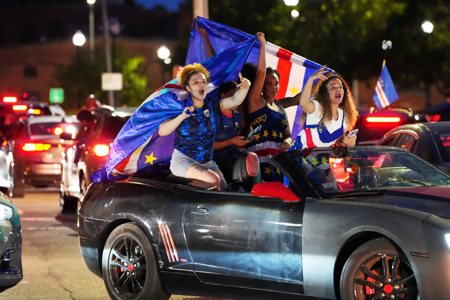 Cape Verde supporters celebrate in cars on the streets after the World Cup Group H soccer match bet...