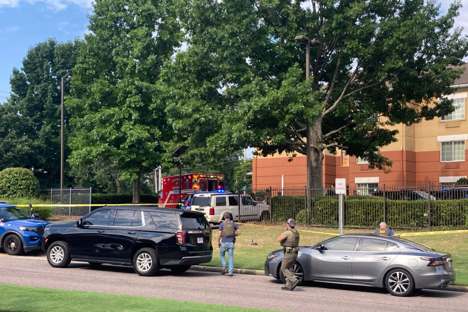 Law enforcement officers work the scene after a federal agent with the Memphis Safe Task Force shot...