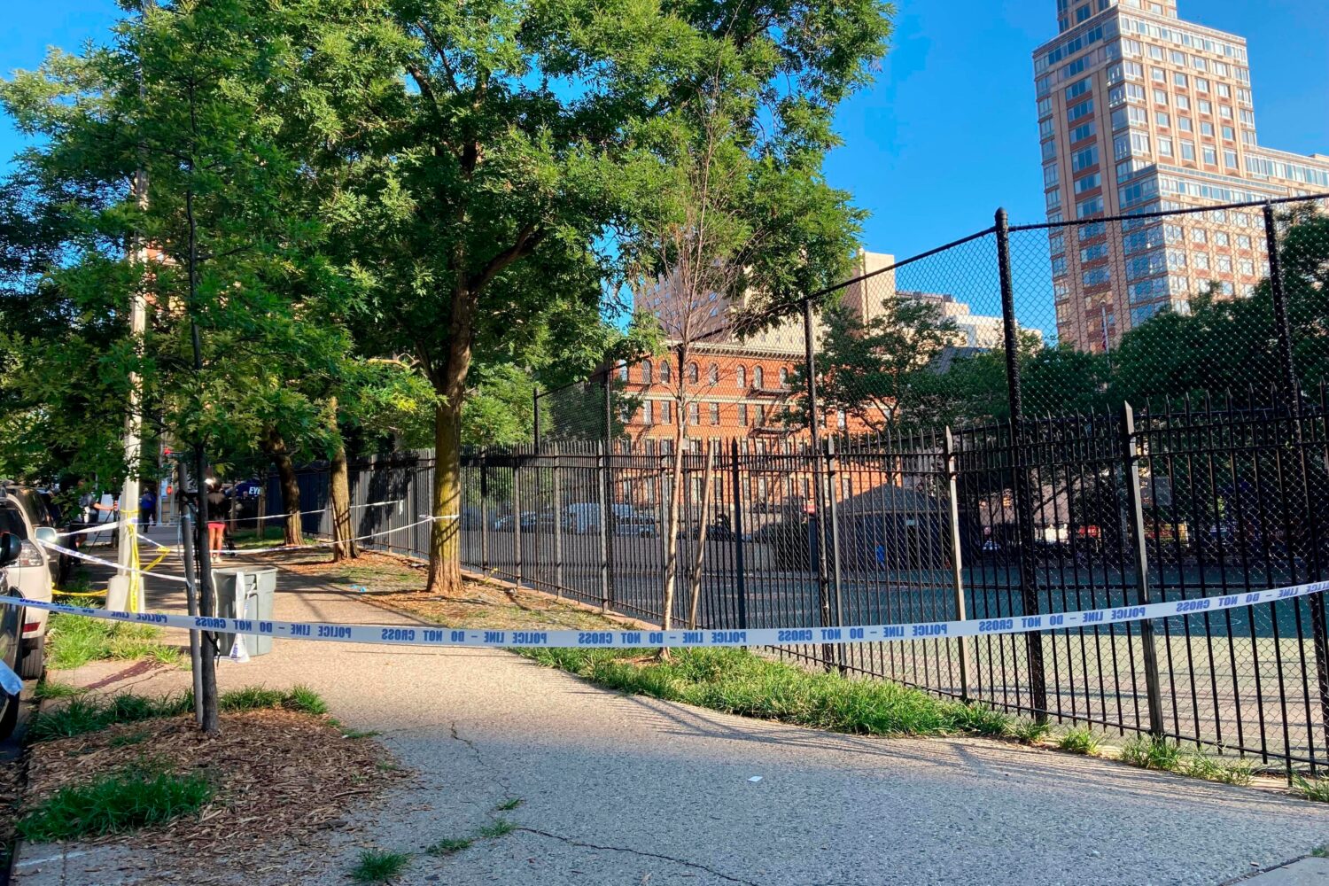 FILE - Crime scene tape surrounds the area on New York's Upper East Side, June 30, 2022, where poli...