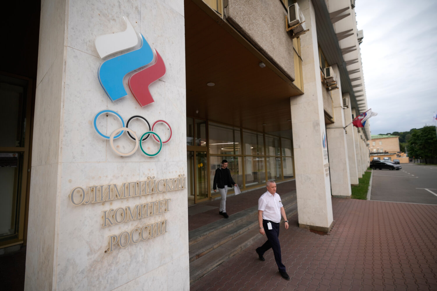 A man walks from the Russian National Olympic Committee building in Moscow, on Tuesday, July 7, 202...