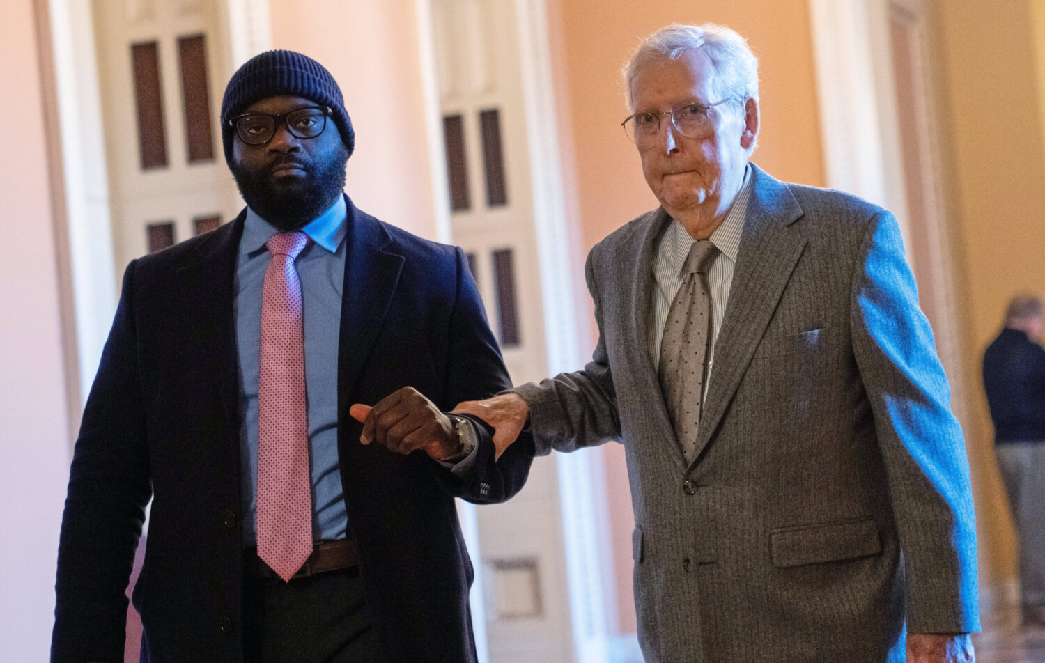 FILE - Sen. Mitch McConnell, R-Ky., right, walks through the Capitol, Jan. 15, 2026, in Washington....