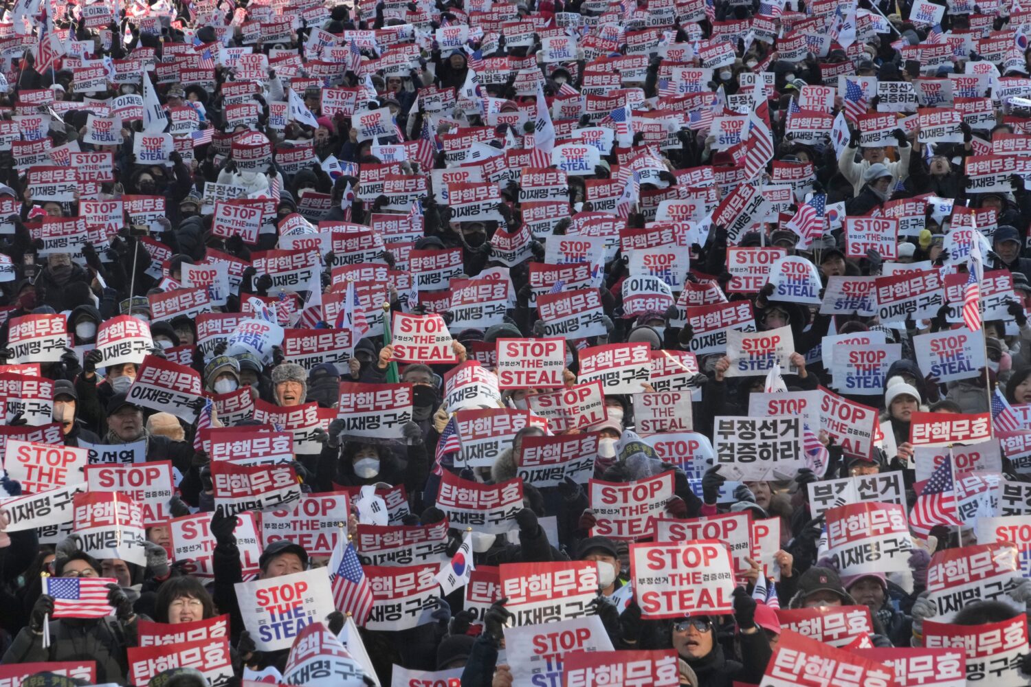 FILE- Supporters of impeached South Korean President Yoon Suk Yeol stage a rally to oppose his impe...
