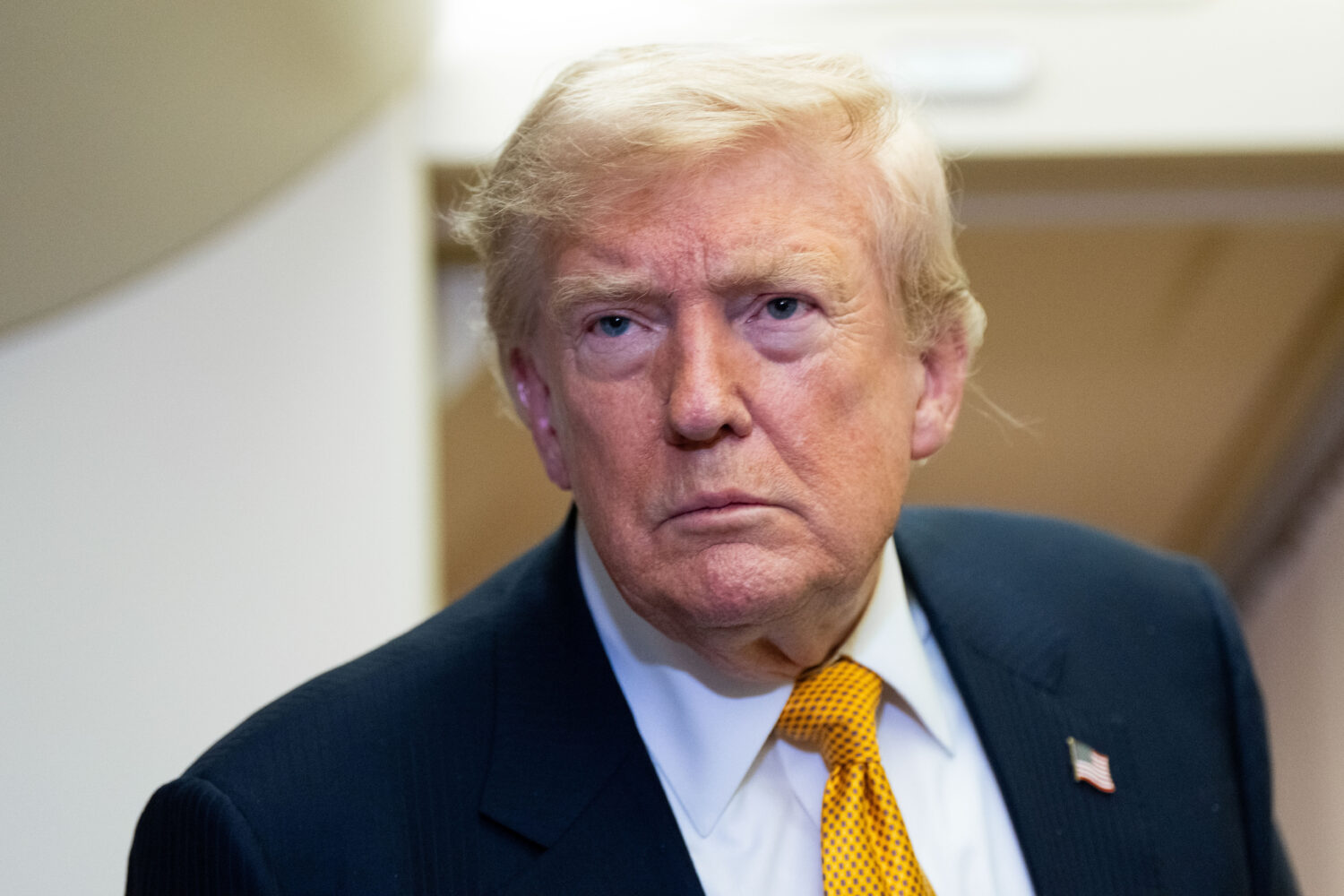 President Donald Trump speaks with reporters in flight on Air Force One after landing at U.S. Air F...