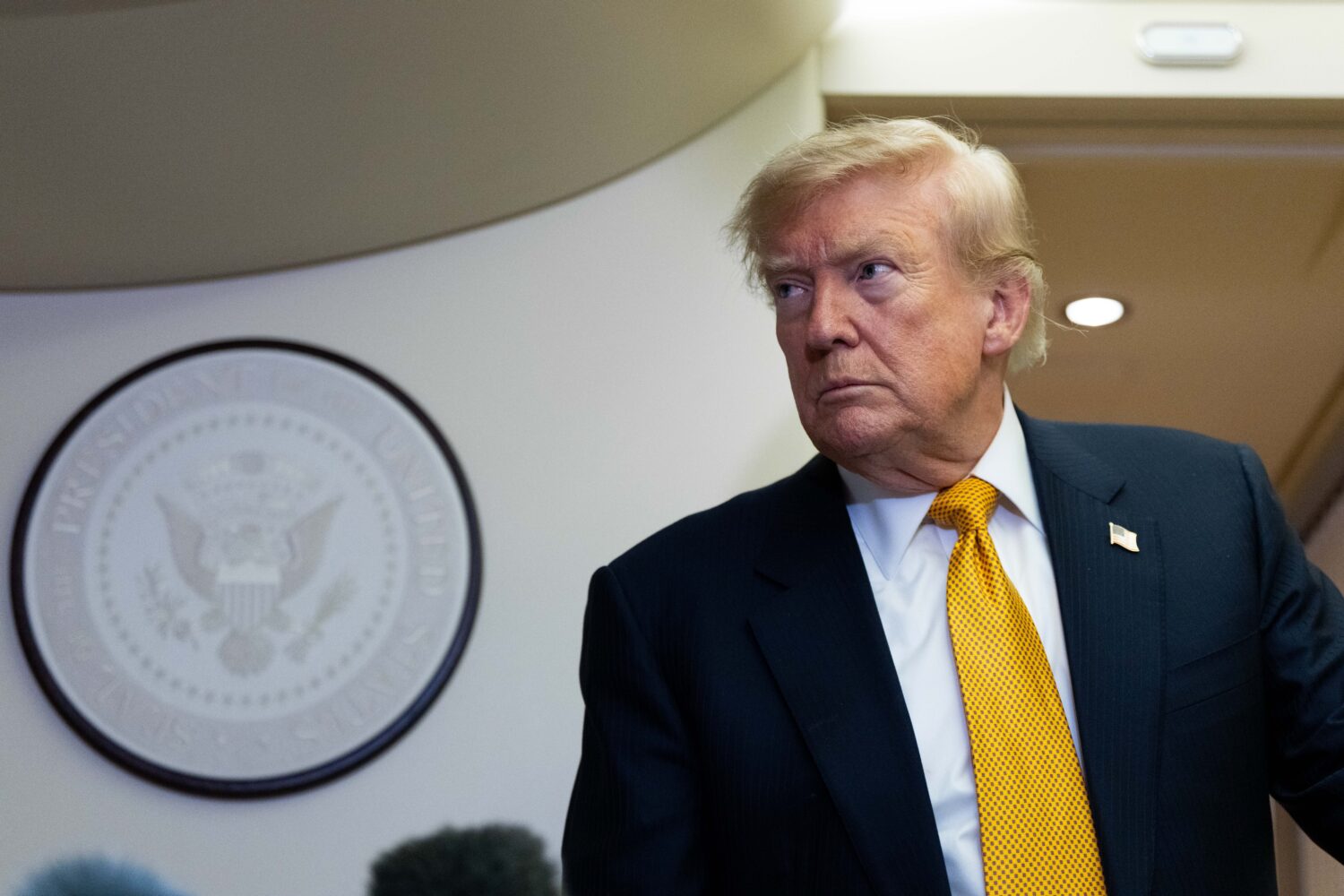 President Donald Trump speaks with reporters in flight on Air Force One after landing at U.S. Air F...