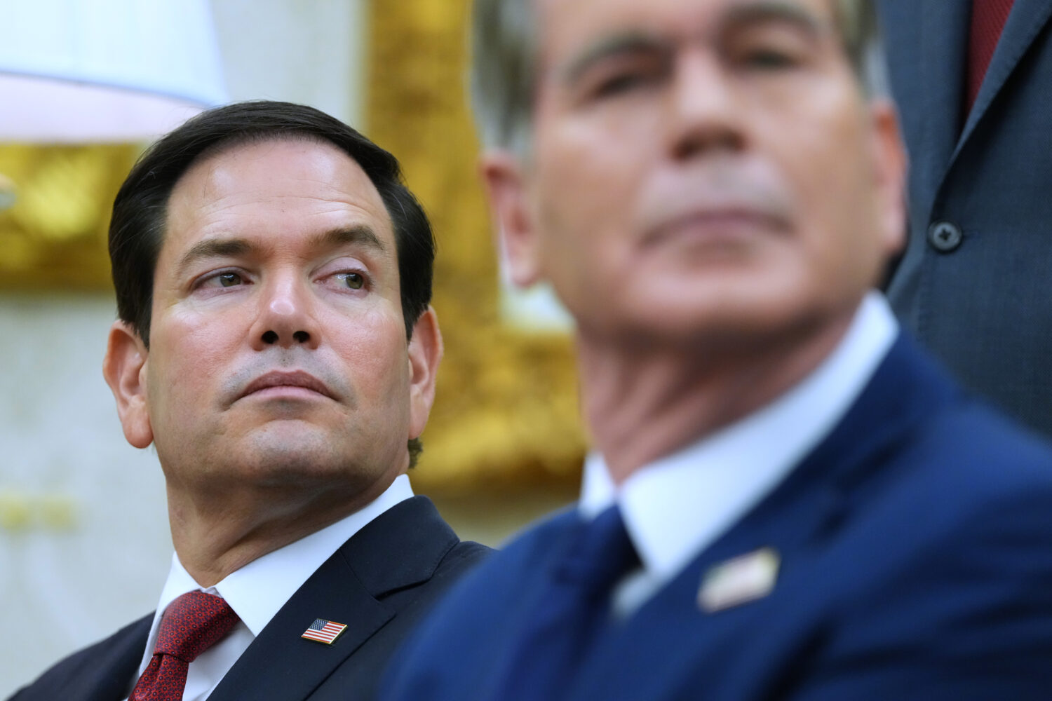 Secretary of State Marco Rubio, left, listen as President Donald Trump meets with Iraq's Prime Mini...