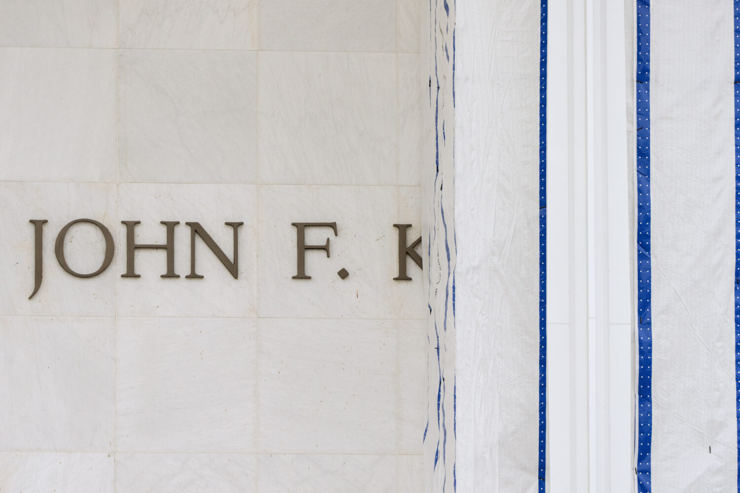 The John F. Kennedy Center for the Performing Arts is seen as its sign remains covered by a tarp, F...