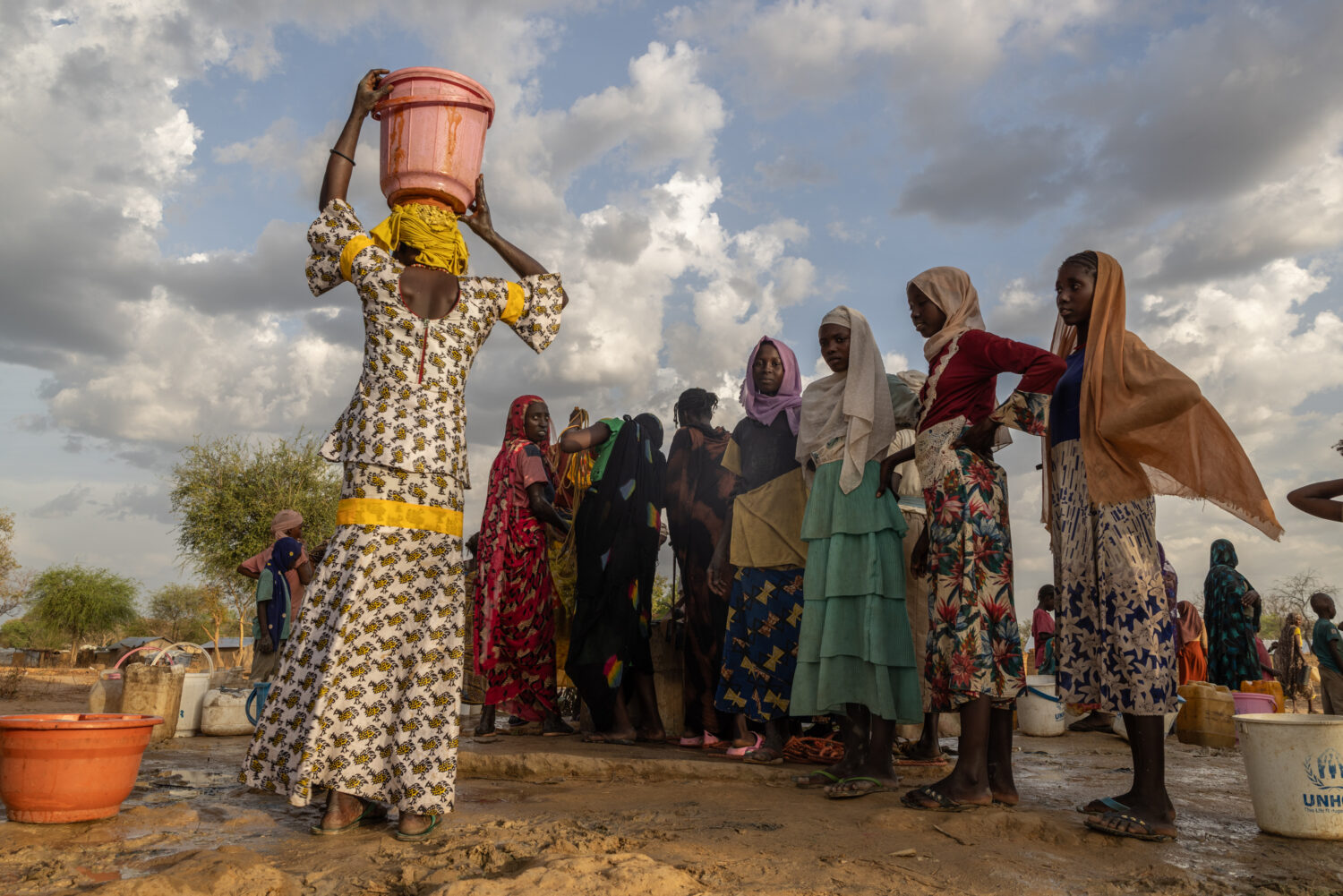 FILE -Women and children fetch water at dusk in the Korsi Refugee Camp in Birao, the Central Africa...