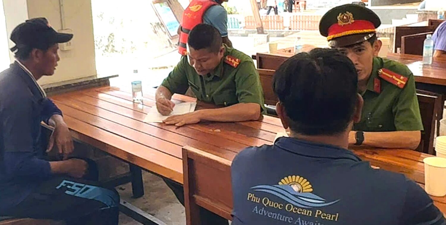 Investigators with crew members involved in the speedboat incident in Phu Quoc, Vietnam, Sunday, Ju...