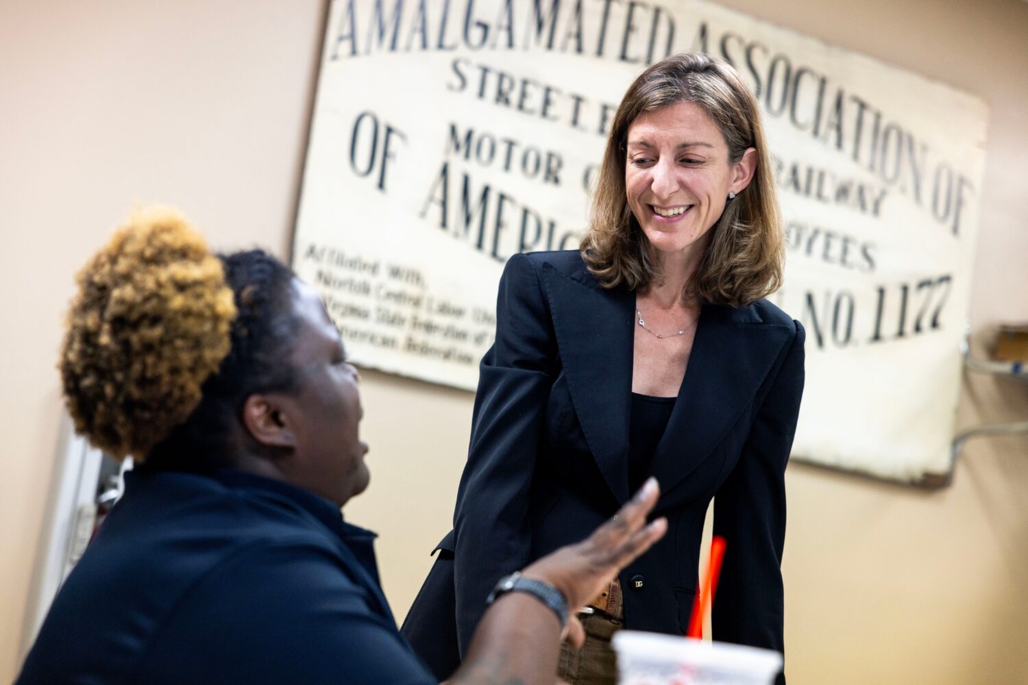 Former Rep. Elaine Luria, D-Va., speaks with Amalgamated Transit Union Local 1177 member Terraine L...