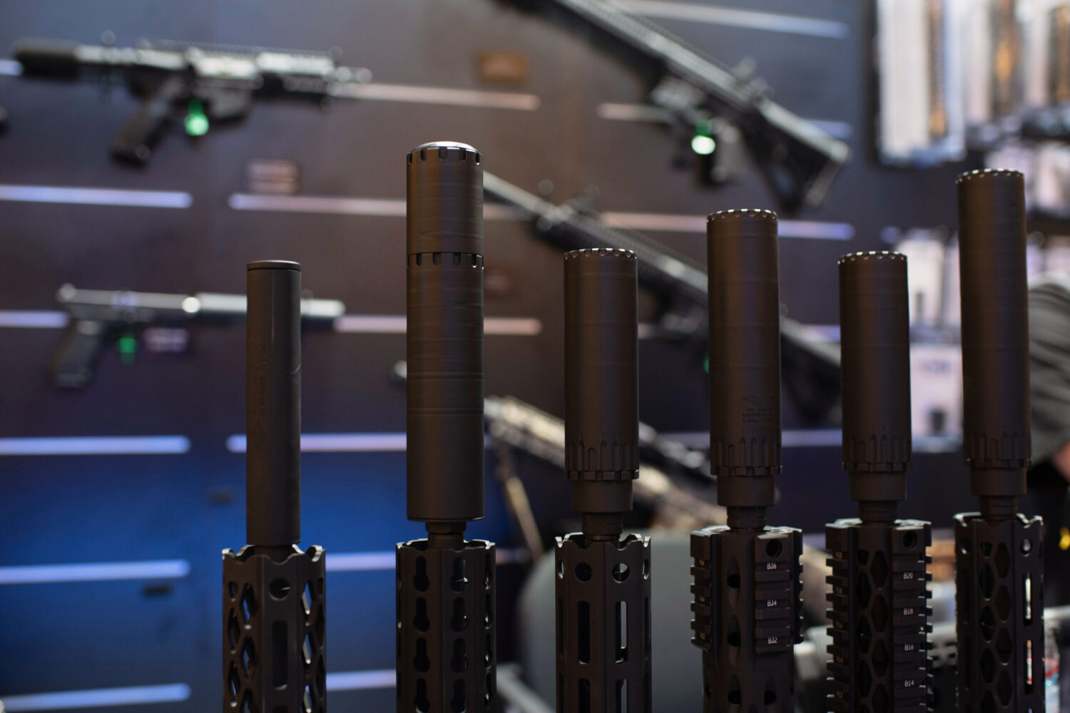 FILE - Firearms and suppressors are displayed at SHOT Show, the annual trade show for the gun indus...