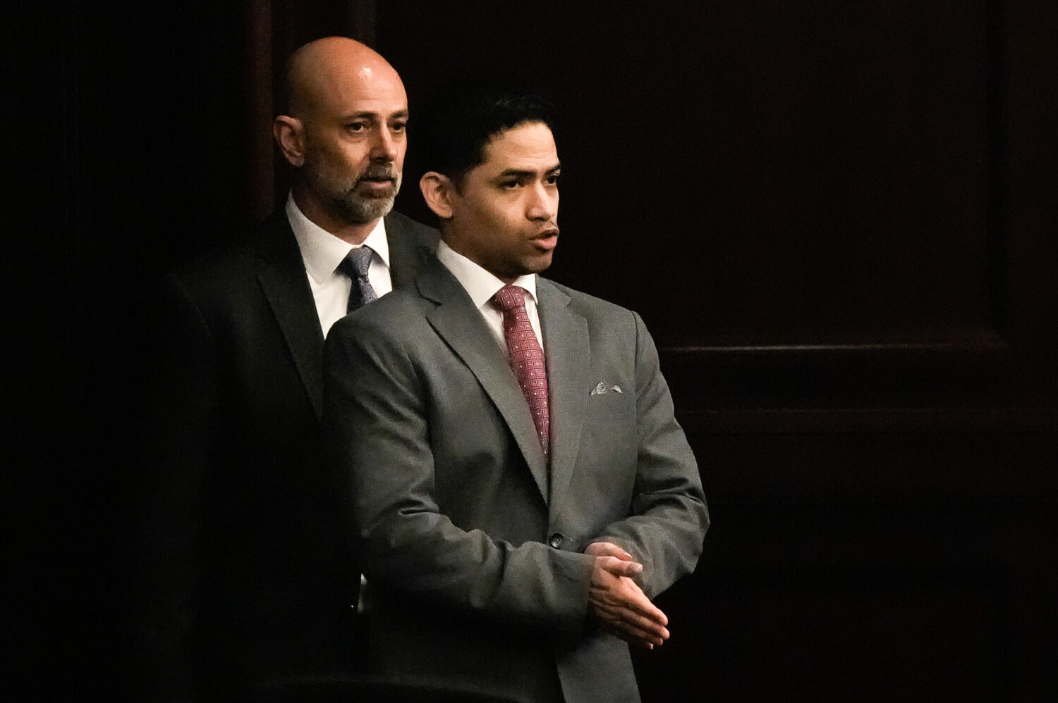 Defense Attorney James Hill, left walks in his client, defendant Mario Fernandez Saldana, during hi...