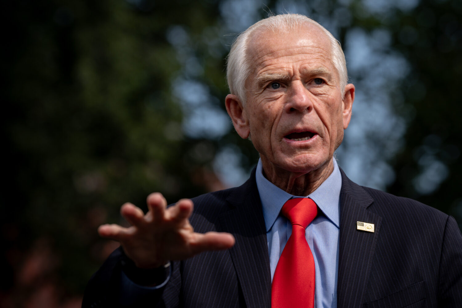 White House trade counselor Peter Navarro speaks with reporters following a video interview with Re...