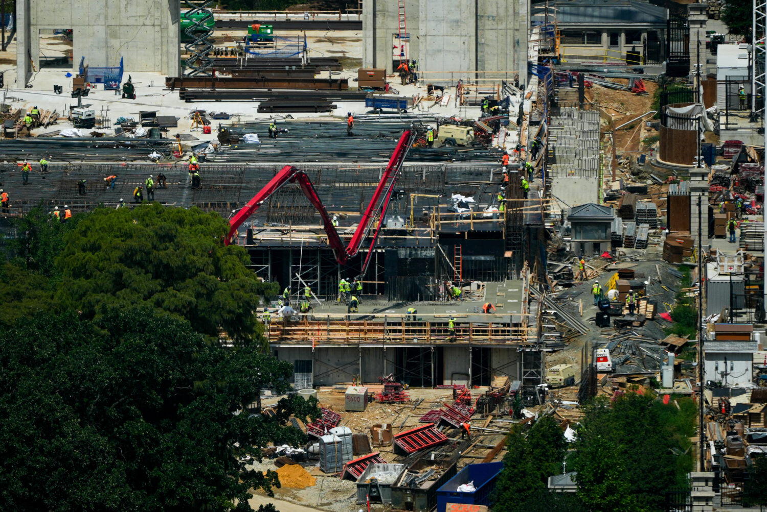 Workers continue construction on the new White House ballroom, as seen from the Washington Monument...